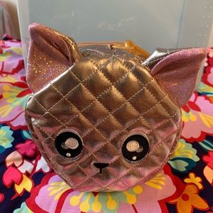 Na! Na! Na! Surprise glam series metallic rose gold Pom chihuahua purse.